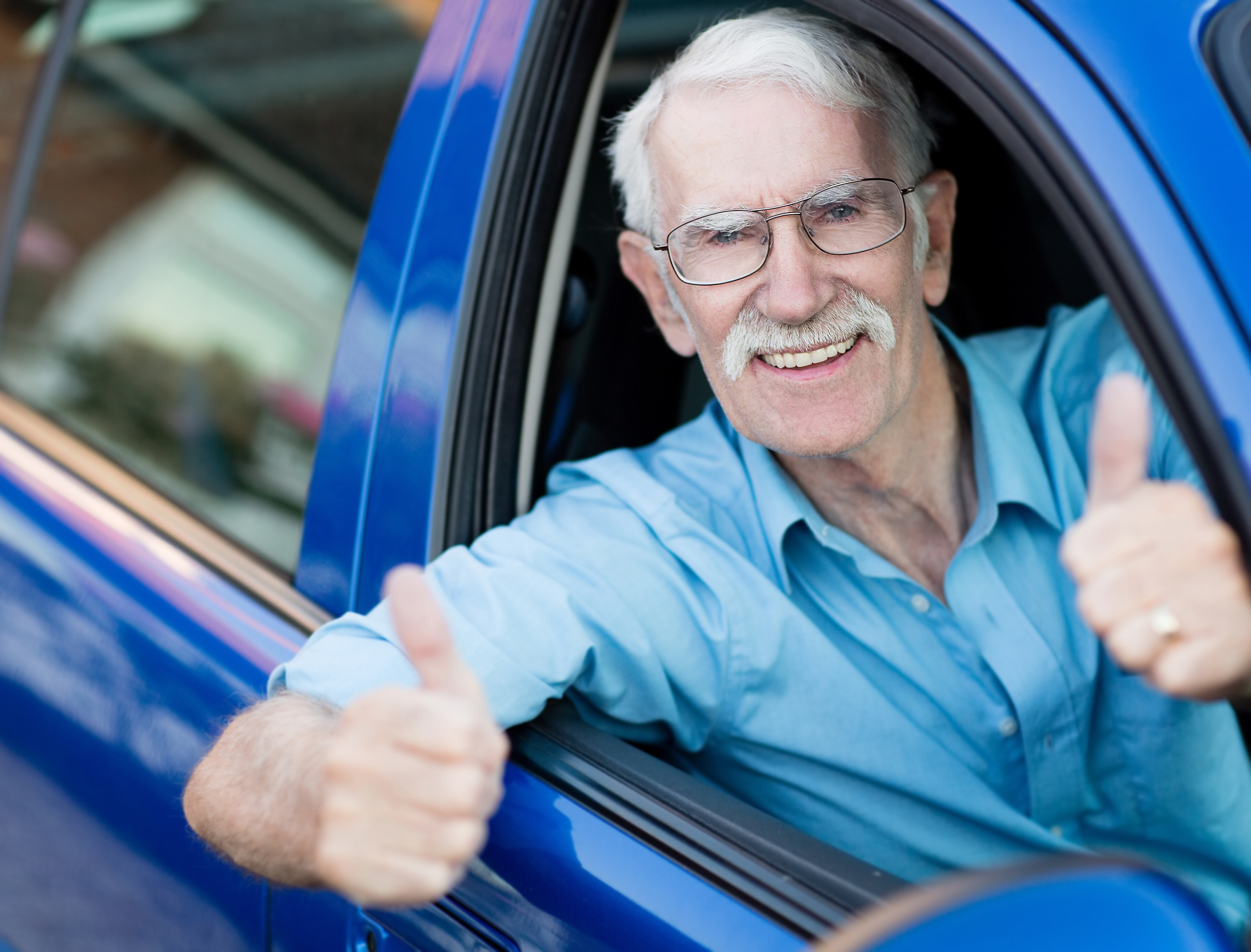 Portrait of Robert T., a wheelchair user client with a genuine smile